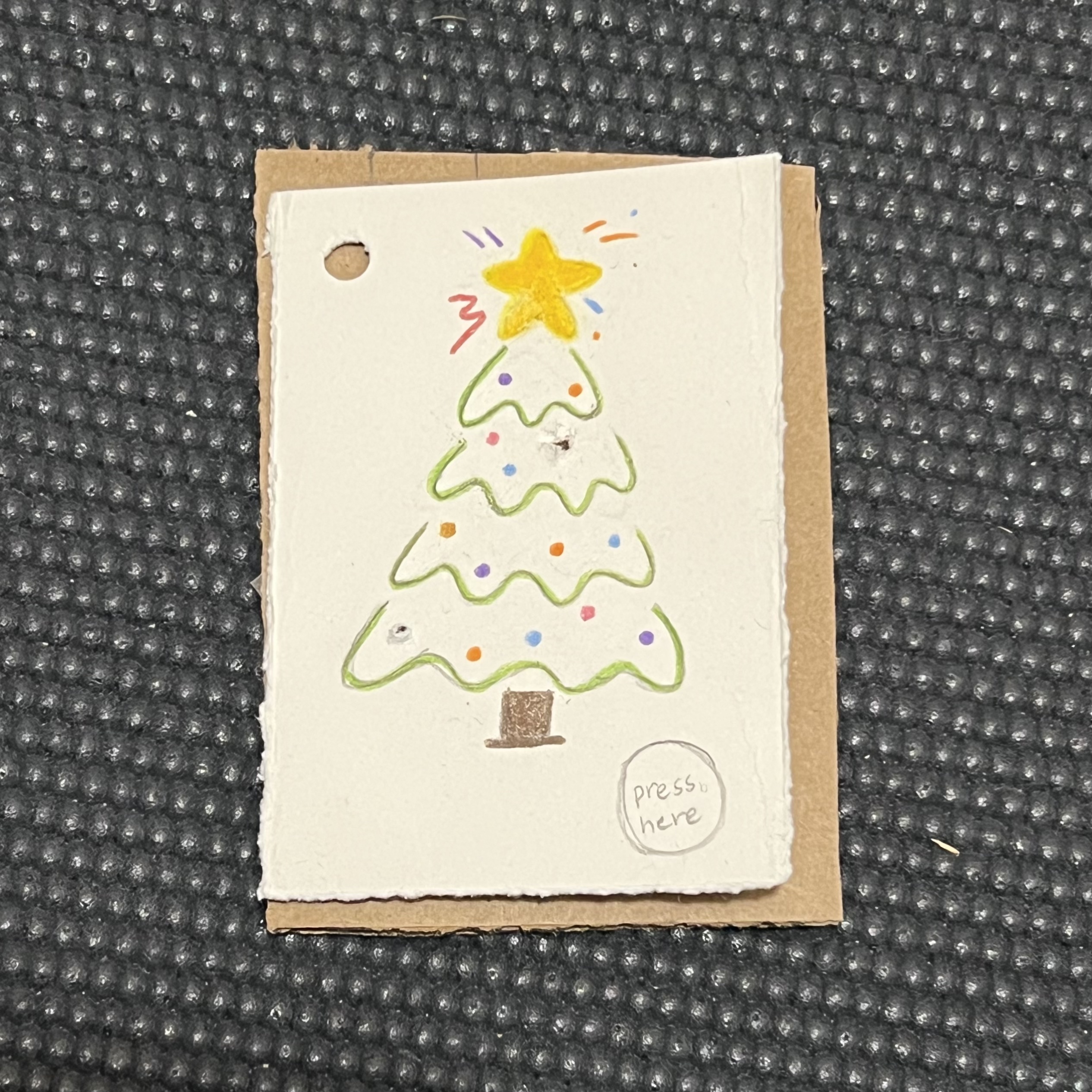 Holiday card with a 'press here' button that would light up on click