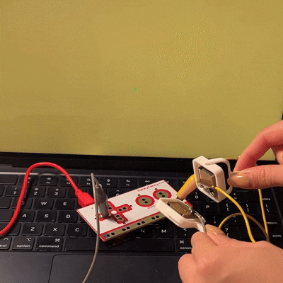 When the two magnets are put together, the two alligator clips touch which outputs a movement to the correspoinding arrow key