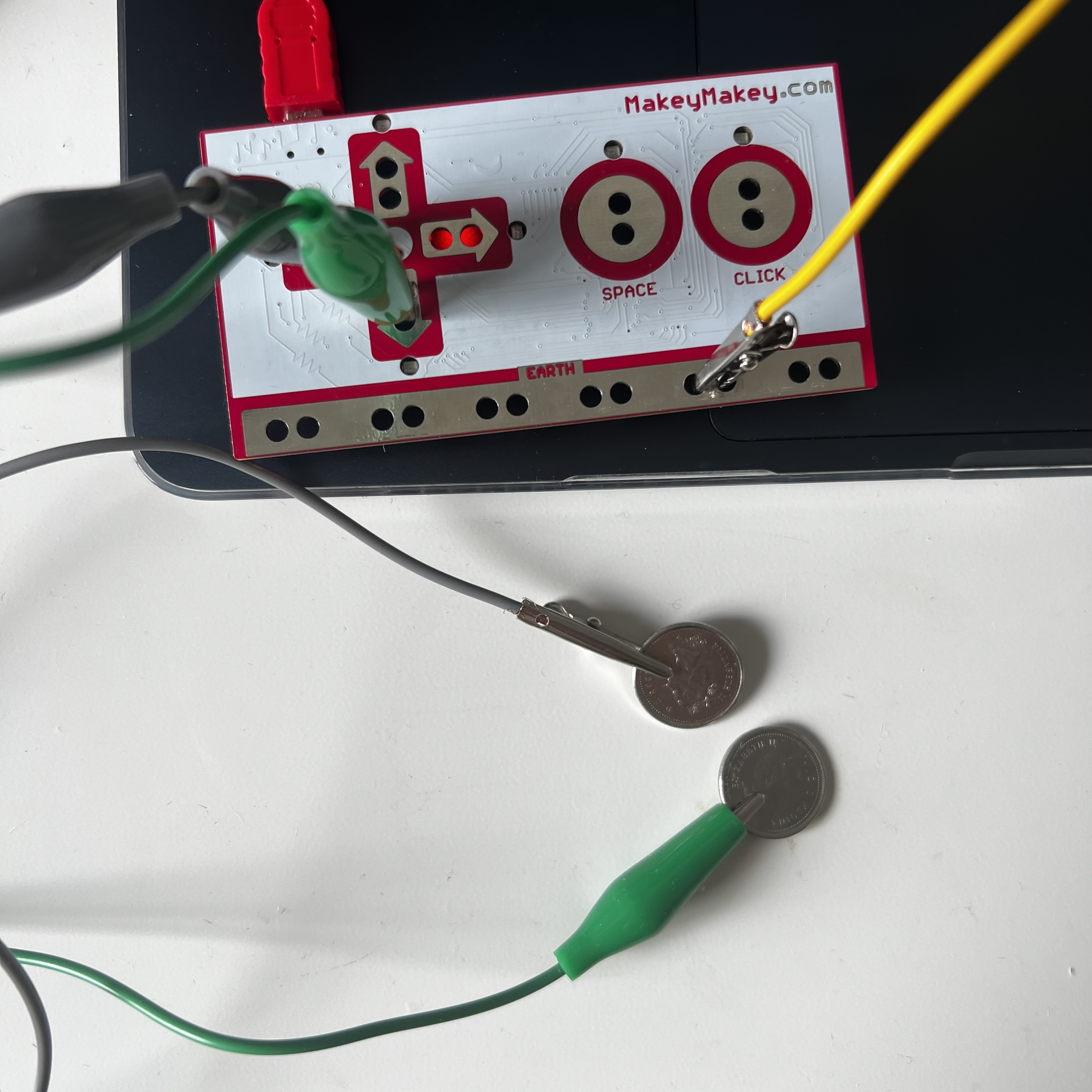 Using dimes as conductors hooked up to Makey Makey clips